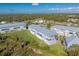 Aerial view of townhouses showcasing a community with lush green spaces at 3923 Cape Haze Dr # 306, Rotonda West, FL 33947