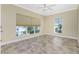 Bright bedroom with tiled floors, large windows, and ceiling fan at 3923 Cape Haze Dr # 306, Rotonda West, FL 33947