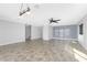 Spacious living room featuring tile floors, ceiling fan and window blinds at 3923 Cape Haze Dr # 306, Rotonda West, FL 33947