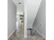 Interior entryway with tile floors and views into the living areas and stairs at 3923 Cape Haze Dr # 306, Rotonda West, FL 33947