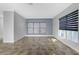 Living room with tile floors and large windows with blinds at 3923 Cape Haze Dr # 306, Rotonda West, FL 33947