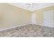 Spacious bedroom with tiled floors, double closets, and ceiling fan at 3923 Cape Haze Dr # 306, Rotonda West, FL 33947
