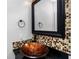 Chic bathroom featuring a vessel sink and mosaic tile backsplash at 3923 Cape Haze Dr # 306, Rotonda West, FL 33947