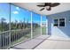 Screened porch with partial view of neighboring buildings at 3923 Cape Haze Dr # 306, Rotonda West, FL 33947