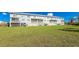 Building exterior showcasing a large lawn at 3923 Cape Haze Dr # 306, Rotonda West, FL 33947