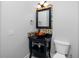 Modern bathroom with glass shower, mosaic tile, and updated vanity at 3923 Cape Haze Dr # 306, Rotonda West, FL 33947