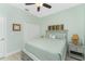 Bright bedroom with a queen-sized bed, neutral décor, and a closet at 552 Box Elder Ct, Englewood, FL 34223