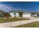 Charming single-story home with a well-maintained lawn and attached two car garage at 552 Box Elder Ct, Englewood, FL 34223
