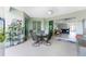 Relaxing screened patio with dining area and easy access to the living room, ideal for entertaining at 552 Box Elder Ct, Englewood, FL 34223