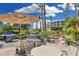 Outdoor patio with grills, seating, and a water feature at 5700 Gulf Shores Dr # C157, Boca Grande, FL 33921