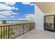 Balcony with ocean view, patio furniture, and access from the living area at 5700 Gulf Shores Dr # C157, Boca Grande, FL 33921