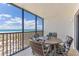 Relaxing balcony with ocean view and seating for four at 5700 Gulf Shores Dr # C157, Boca Grande, FL 33921