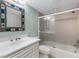 Bathroom with a shower/tub combo, white vanity, and decorative mirror at 5700 Gulf Shores Dr # C157, Boca Grande, FL 33921