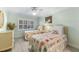 Bright guest bedroom with twin beds, dresser, and light flooring at 5700 Gulf Shores Dr # C157, Boca Grande, FL 33921