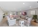 Spacious living room with comfy seating, large TV, and coastal decor at 5700 Gulf Shores Dr # C157, Boca Grande, FL 33921