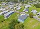 Aerial view shows the property outlined in red within a quiet, well-maintained community at 5704 Holiday Park Blvd, North Port, FL 34287