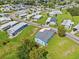 Aerial view shows the property outlined in red within a peaceful community at 5704 Holiday Park Blvd, North Port, FL 34287