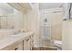 Clean bathroom featuring a single sink vanity and a glass-enclosed shower with a towel bar at 5704 Holiday Park Blvd, North Port, FL 34287