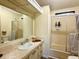 Bright bathroom featuring a shower and a vanity with lots of storage space for your essentials at 5704 Holiday Park Blvd, North Port, FL 34287