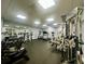 Bright fitness center with various exercise machines, weights, and ample space for residents' well-being at 5704 Holiday Park Blvd, North Port, FL 34287