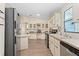 Well-equipped kitchen with appliances, ample counter space, and neutral cabinetry, perfect for meal preparation and Gathering gatherings at 5704 Holiday Park Blvd, North Port, FL 34287