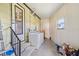 Bright laundry area features a washer and dryer conveniently located near the entry door at 5704 Holiday Park Blvd, North Port, FL 34287