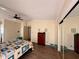 Well-lit main bedroom with hardwood floors, closet and a calm ambiance at 5704 Holiday Park Blvd, North Port, FL 34287