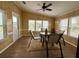 Cozy sunroom with a table, chairs, and plenty of natural light at 5704 Holiday Park Blvd, North Port, FL 34287