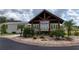 Welcoming community entrance with covered seating area at 9085 Pinehaven Way, Englewood, FL 34224