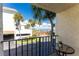 Balcony view overlooking water and landscaping at 1551 Beach Rd # 213, Englewood, FL 34223