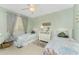 Guest bedroom with twin beds, dresser, and coastal-themed decor at 1551 Beach Rd # 213, Englewood, FL 34223