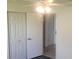 Spacious bedroom with double doors leading to another room at 13528 Martha Ave, Port Charlotte, FL 33981