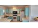 Small kitchen with light blue cabinets and white countertops at 13528 Martha Ave, Port Charlotte, FL 33981