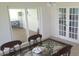 Dining area with glass-top table, French doors, and sliding glass doors at 13528 Martha Ave, Port Charlotte, FL 33981