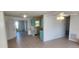 Kitchen with light blue cabinets, white appliances, and tiled floors at 13528 Martha Ave, Port Charlotte, FL 33981