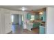 Small kitchen with light blue cabinets and white countertops at 13528 Martha Ave, Port Charlotte, FL 33981