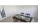 Bright dining room with glass-top table and four chairs at 13528 Martha Ave, Port Charlotte, FL 33981
