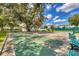 Shuffleboard courts with benches under shady trees at 19385 Water Oak Dr # L-106, Port Charlotte, FL 33948