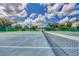 Tennis court with net at 19385 Water Oak Dr # L-106, Port Charlotte, FL 33948