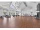 Spacious community room with high ceilings and fireplace at 19385 Water Oak Dr # L-106, Port Charlotte, FL 33948