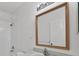 Simple bathroom with a single vanity, mirror and shower/tub at 19385 Water Oak Dr # L-106, Port Charlotte, FL 33948
