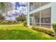 Ground floor condo with a private screened porch and backyard at 19385 Water Oak Dr # L-106, Port Charlotte, FL 33948