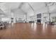 Large community room with hardwood floors and fireplace at 19385 Water Oak Dr # L-106, Port Charlotte, FL 33948