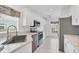 Modern kitchen featuring white cabinets and stainless steel appliances at 19385 Water Oak Dr # L-106, Port Charlotte, FL 33948