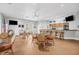 Community room with tables, chairs, and a bar area at 19385 Water Oak Dr # L-106, Port Charlotte, FL 33948