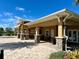 Community clubhouse with covered patio and stone pillars at 5043 Sunnyside Ln, Bradenton, FL 34211