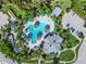 Community pool and clubhouse viewed from above at 11044 Hogan Cir, Englewood, FL 34223