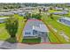 Bird's eye view of a light blue manufactured home and its lot at 5704 Holiday Park Blvd, North Port, FL 34287