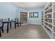 Quiet reading room with built-in bookshelves at 404 Cypress Forest Dr, Englewood, FL 34223