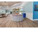 Community clubhouse interior with seating area and large windows at 404 Cypress Forest Dr, Englewood, FL 34223